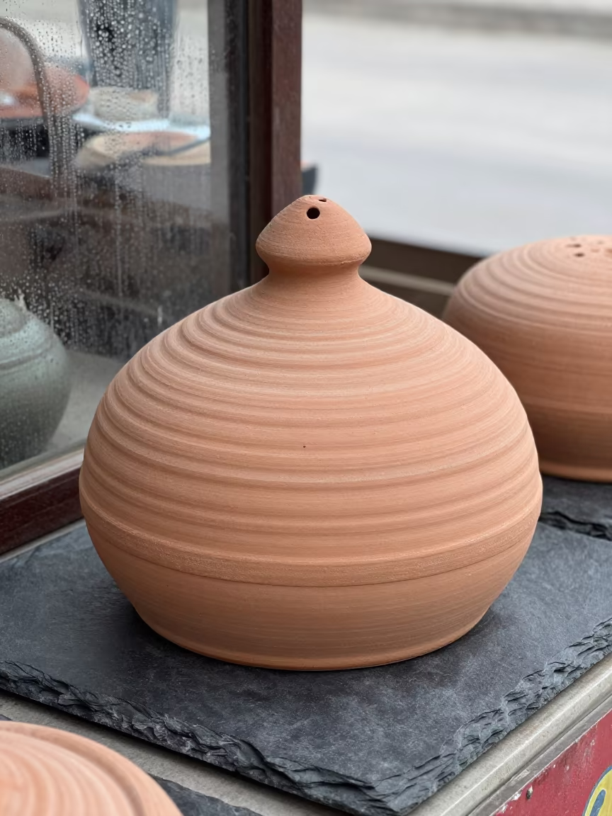 Ceramic Beehive Cheese Dome on Slate in Samarkand in at a market stall counter in Samarkand