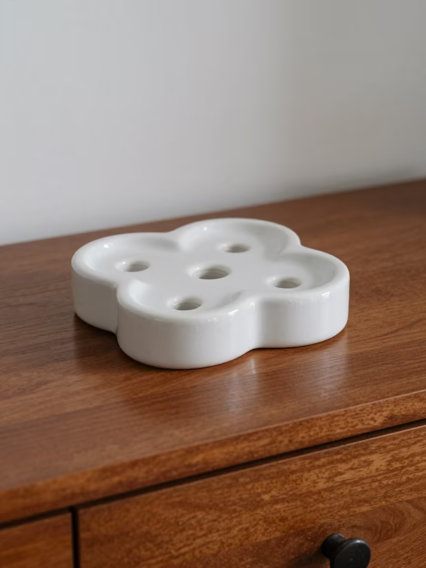 Ceramic Flower Brick on Hotel Dresser in on a hotel dresser in Houston