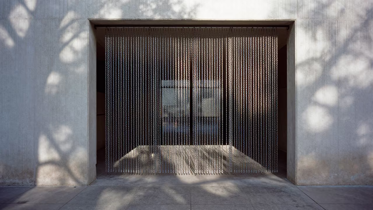 Chain Curtain Light Play in El Paso Lobby in inside a ribbed concrete lobby in El Paso