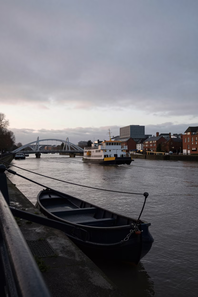 Chain Ferry Crossing Bristol River Before Dawn with Moored Longtail Boat in in Bristol, United Kingdom