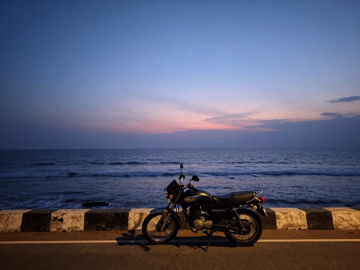 Chennai India Coastline at Nautical Dawn with Motorcycle and Plumeria Petals in in Chennai, India