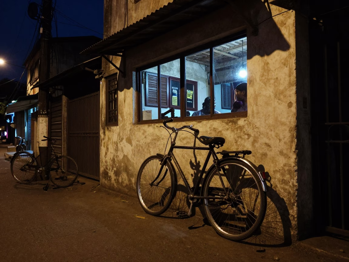 Chennai India Night Street Scene with Bicycle Leaning Against Cafe Under Deep Sky in in Chennai, India