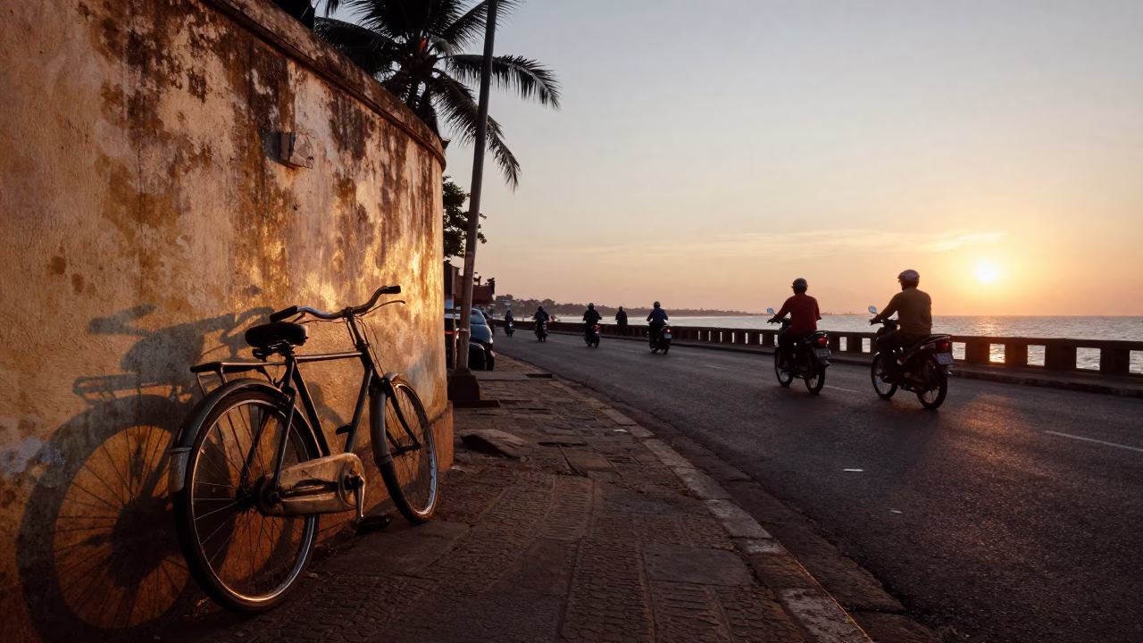 Chennai India Sunset Street Scene with Vintage Bicycle and Coastal Highway Traffic in in Chennai, India
