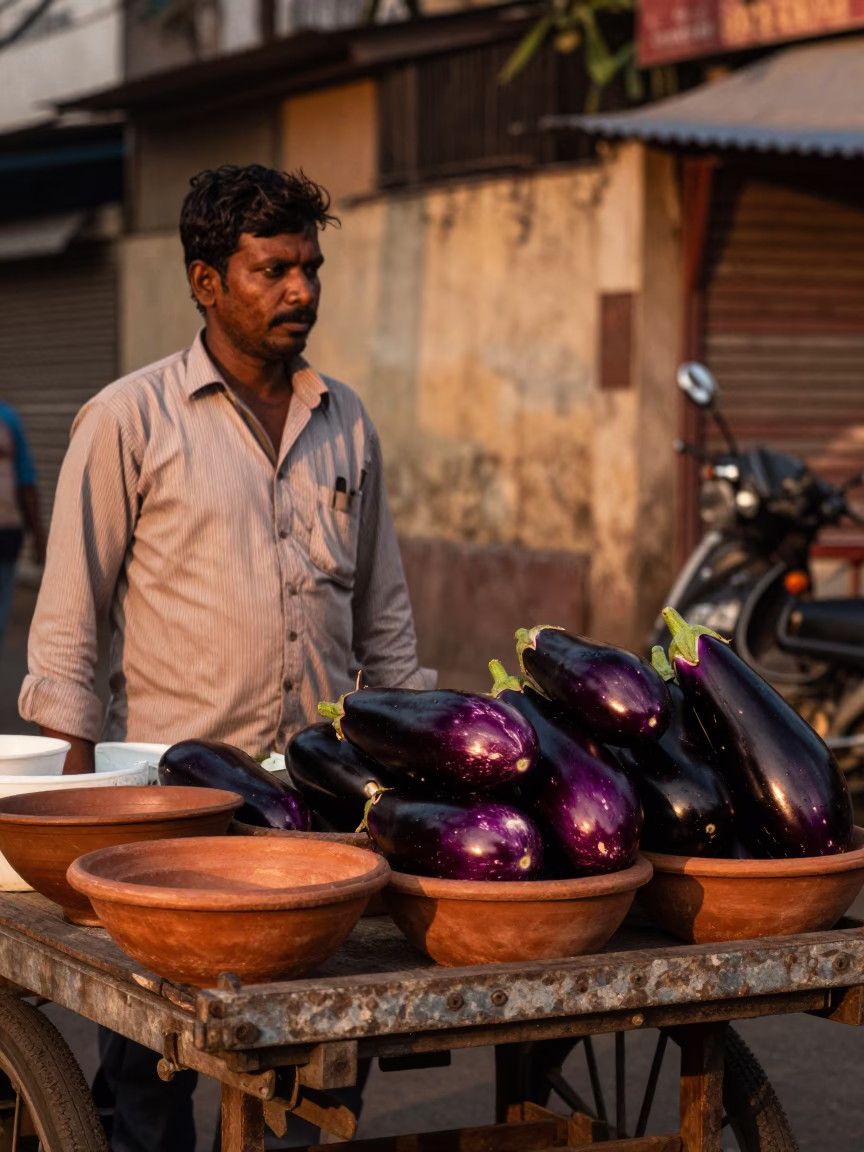 Chennai Street Vendor Displaying Fresh Eggplants and Terracotta Bowls in Copper Dusk Light in in Chennai, India