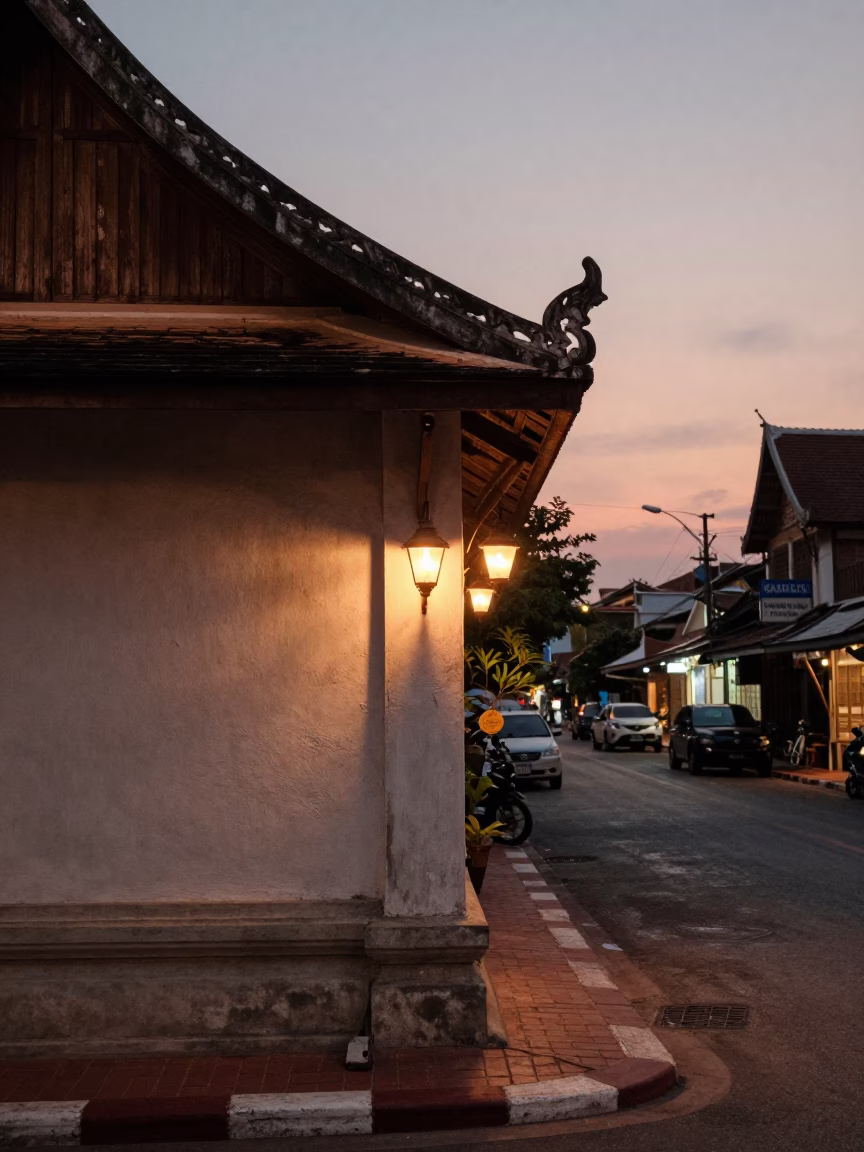 Chiang Mai Thailand Dusk Street Scene with Wall Sconce and Local Market Activity in in Chiang Mai, Thailand
