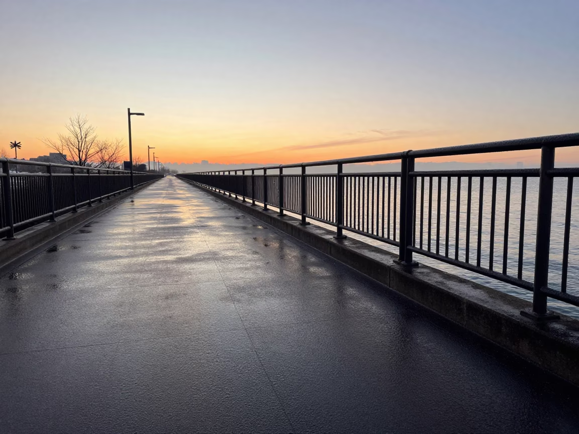 Chicago Lakefront Trail Sunrise with Condensation on Rail and Urban Skyline in in Chicago, Illinois, United States