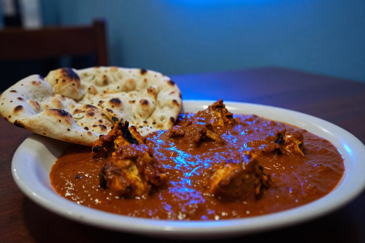 Chicken Tikka Masala on Neon Diner Table in at a roadside diner table in Beijing
