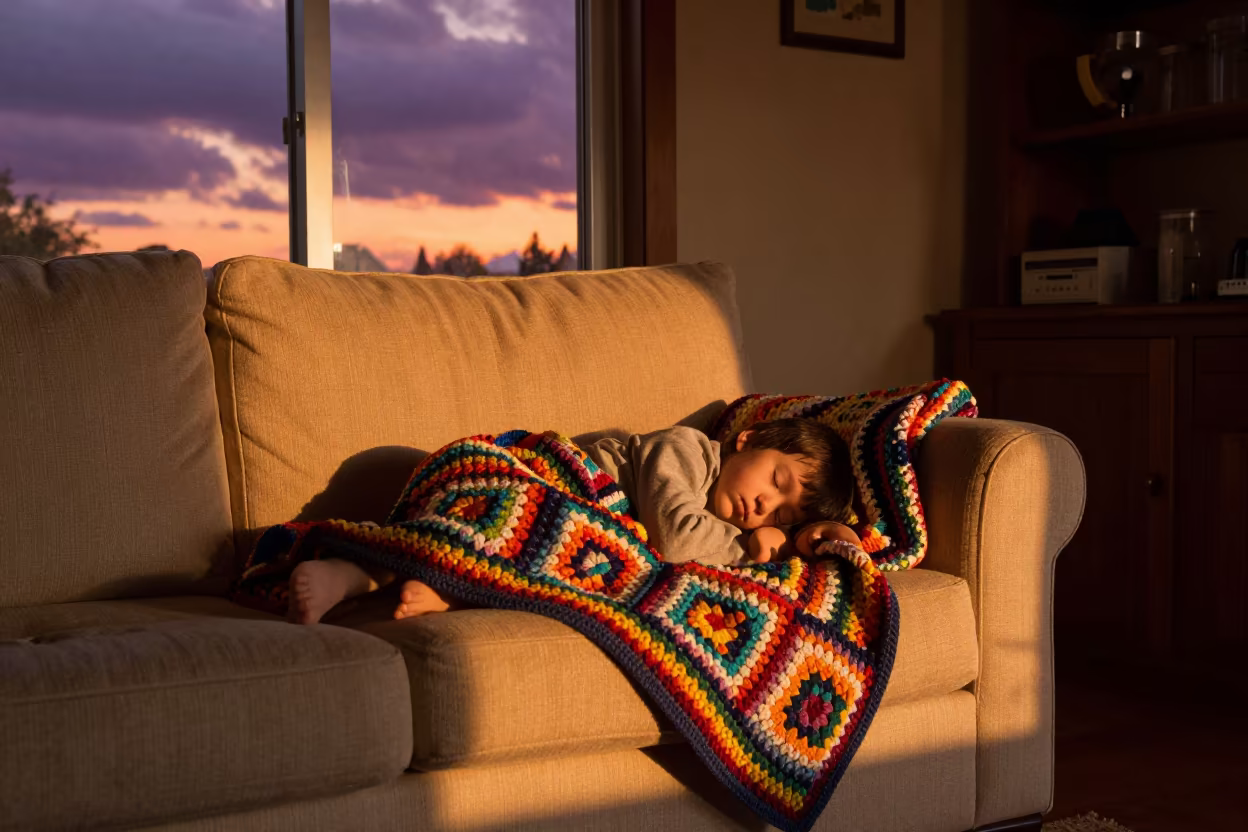 Child Sleeping on Sofa Under Crocheted Blanket in near Hefei