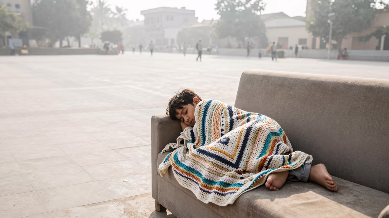 Child Sleeping on Sofa in Jacobabad Square in at a public square in Jacobabad