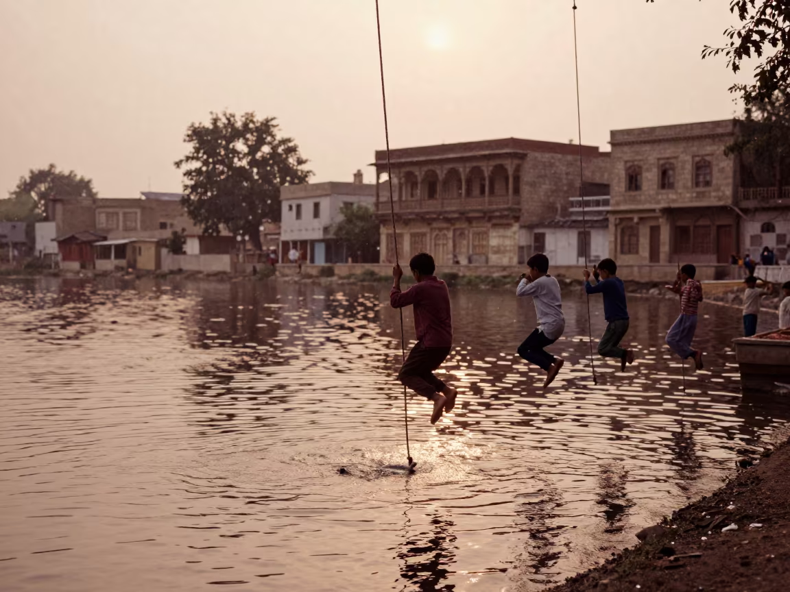 Children Rope Swing Jumping Chakwal Lake Dusk in in the old quarter in Chakwal