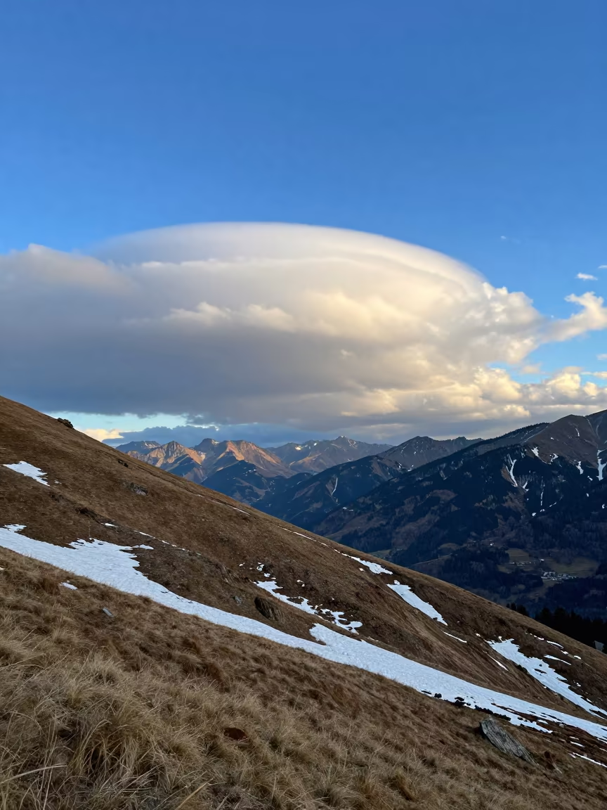 Chinook Arch Cloud Over Austrian Foothills in over a horizon of stacked thunderheads in Austria