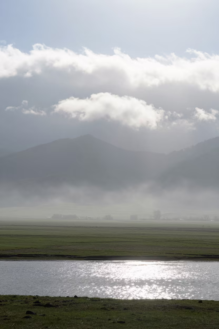 Chinook Arch Cloud Over Kashmir Foothills in across a storm-bright plain in Kashmir