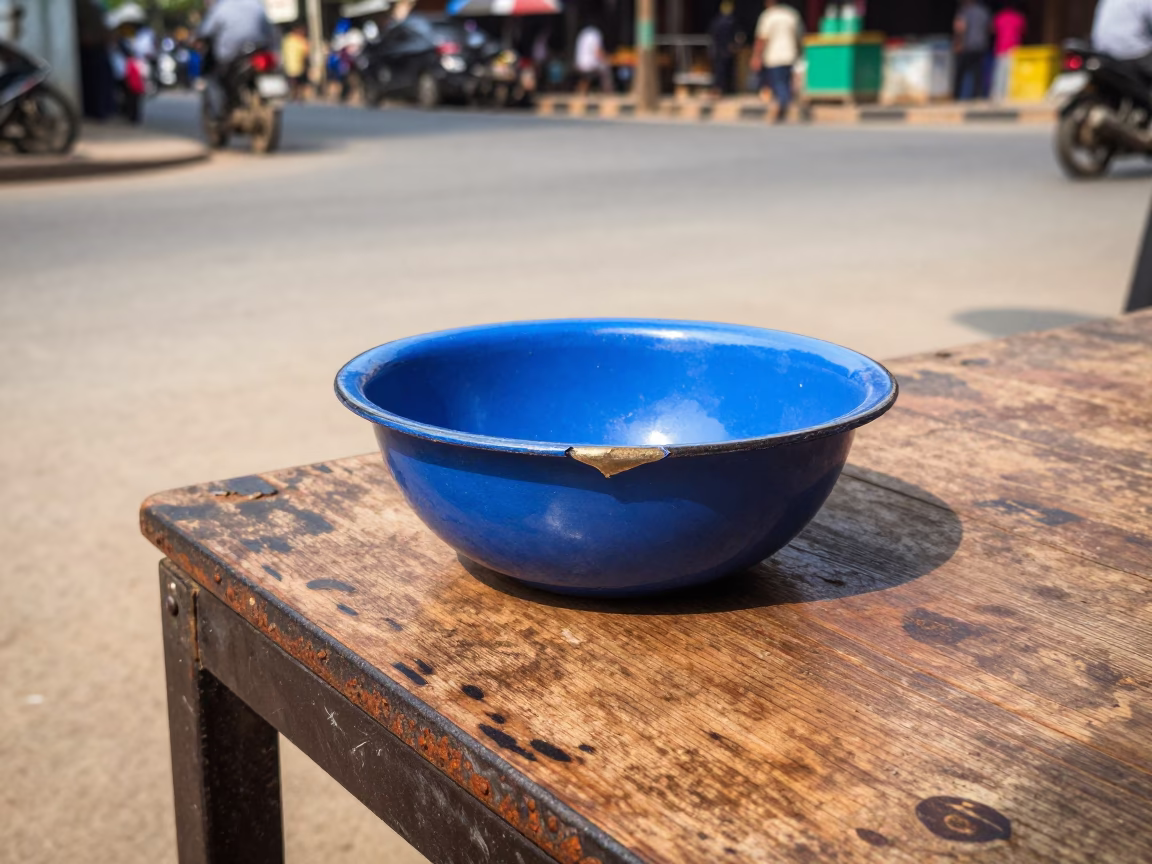 Chipped Blue Enamel Bowl in Phnom Penh in in Phnom Penh, Cambodia