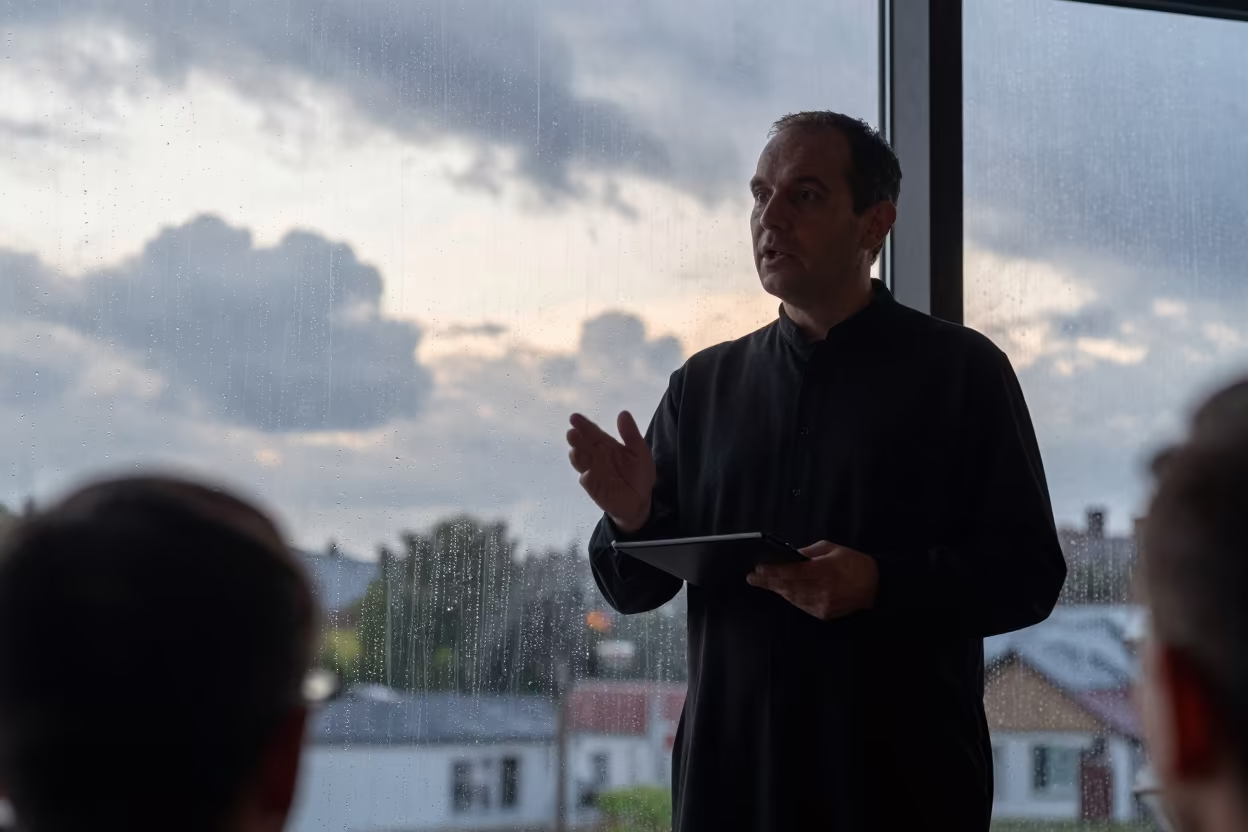 Choir Director Beside Rain Streaked Glass in in Keur Massar Nord