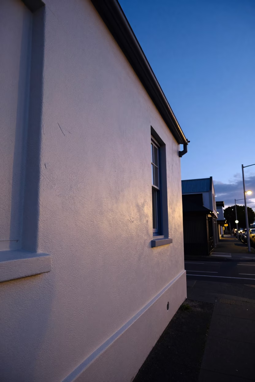 Christchurch Evening Light Illuminating Plaster Wall and Street Scene in in Christchurch, New Zealand