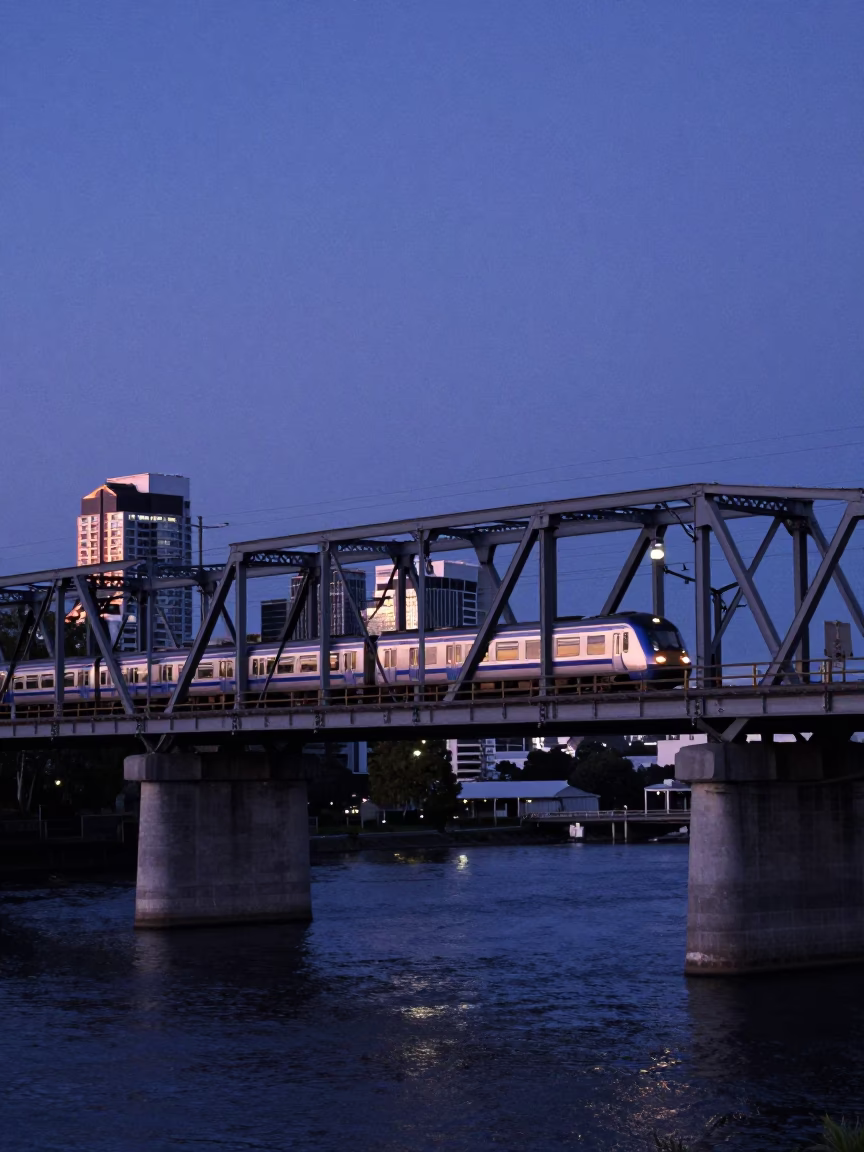 Christchurch New Zealand Indigo Twilight Commuter Train Crossing Bridge Blue Hour in in Christchurch, New Zealand
