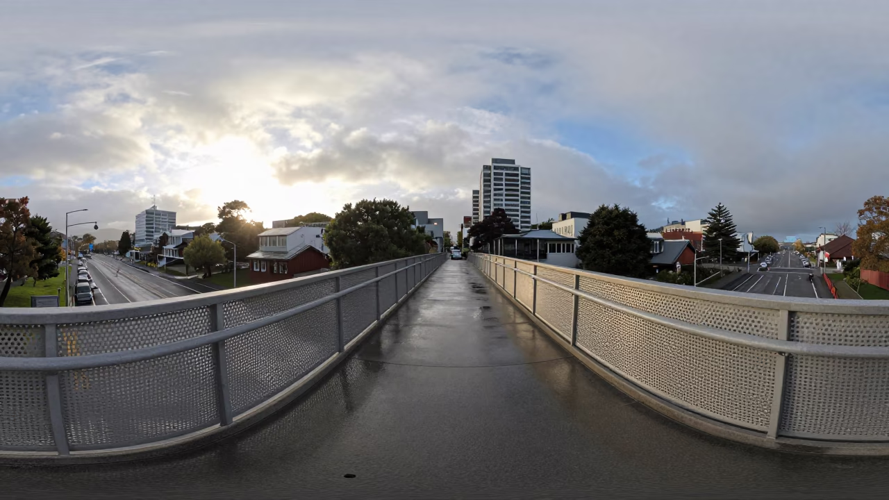 Christchurch pedestrian overpass with perforated metal railings and wet footsteps after sunrise in in Christchurch, New Zealand