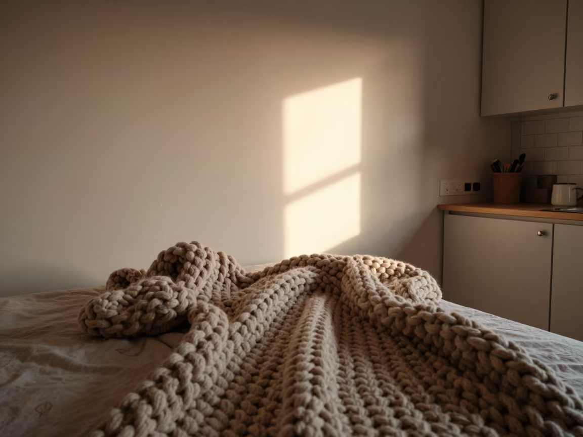 Chunky Knit Blanket on Unmade Bed in Kunming Kitchen in in a cozy kitchen near Kunming