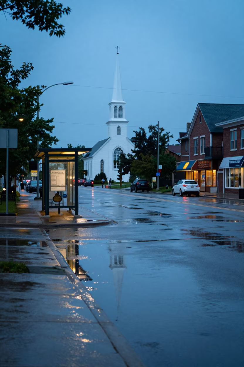 Church Steeple Reflection in Rain Puddle Sudbury in at a tram stop in Greater Sudbury