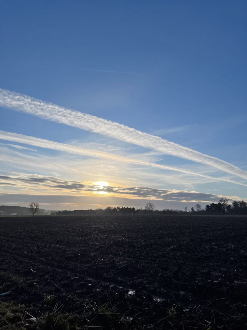 Cirrus Clouds Over Stormy Winter Plain Near Basel in across a storm-bright plain near Basel
