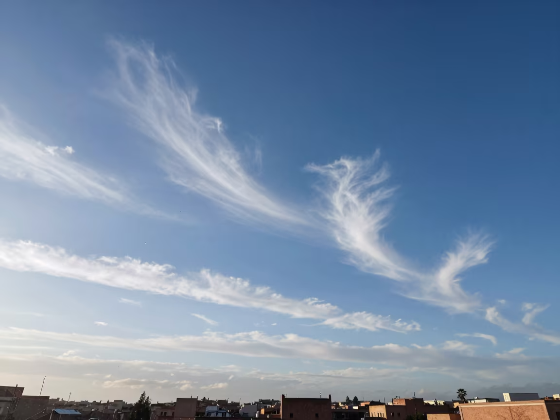 Cirrus Uncinus Clouds Over Marrakesh Monsoon in beneath fast-moving cloud bands near Marrakesh