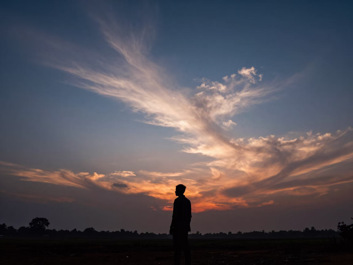 Cirrus Uncinus Streaks Over Winter Plain at Dusk in across a storm-bright plain near Thiruvananthapuram