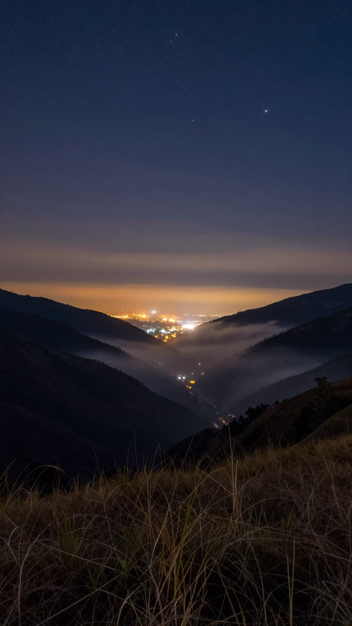 City Bokeh Lights Over Alpine Night in from a quiet alpine saddle near Gujranwala
