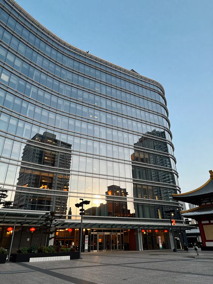 City Lights Reflection Curved Glass Temple Victoria in in a lantern-lined temple precinct in Victoria