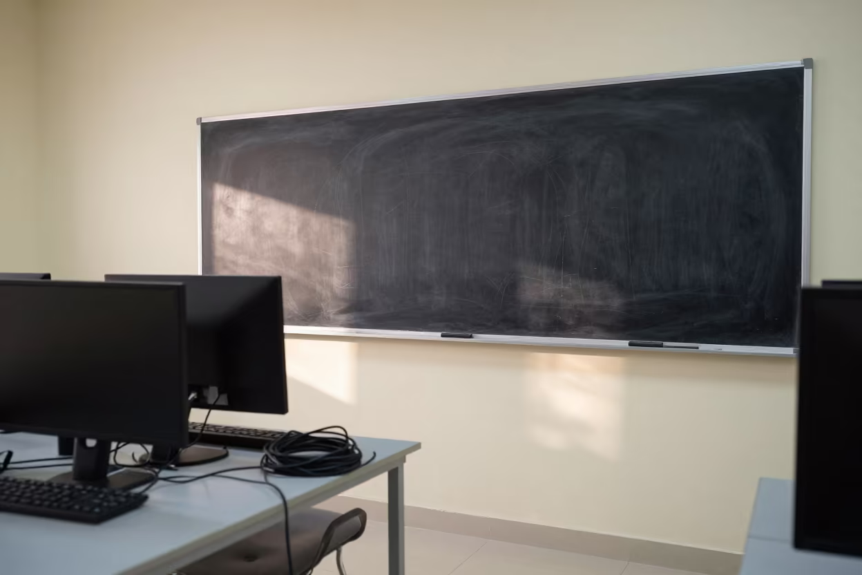 Classroom Blackboard and Coiled Chargers at Nautical Dawn in in a computer lab before lessons in Sheikh Othman