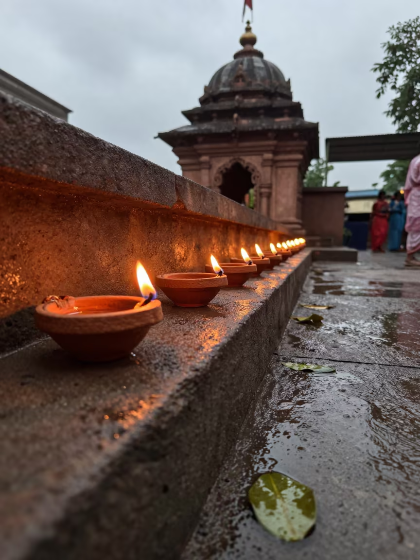 Clay Diwali Lamps Glow in Monsoon Shrine in in a shrine lined with lanterns near Kolkata