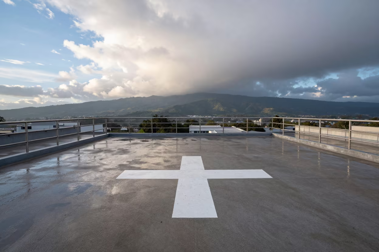 Clean Hospital Helipad After Sleet in Zapopan in beside a marked medical landing pad in Zapopan
