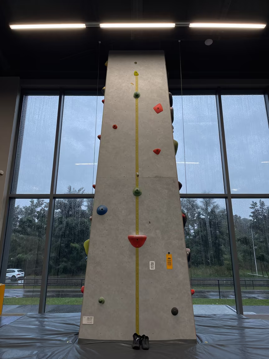 Climbing Wall Gear Under Fluorescent Dawn Light in inside a spin studio under class lights in Keur Massar Nord