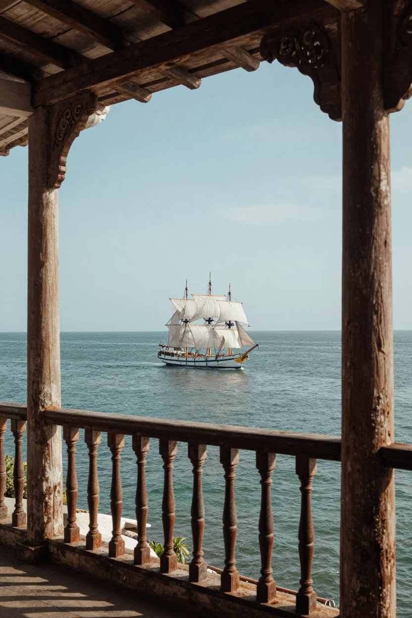 Colonial Balcony View of Cartagena Bay with Tall Ship Sailing in Early Afternoon Light in in Cartagena, Colombia