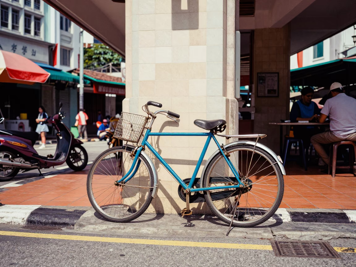 Colorful 1970s Kuala Lumpur Street Scene with Bicycle and Local Cafe Culture in in Kuala Lumpur, Malaysia