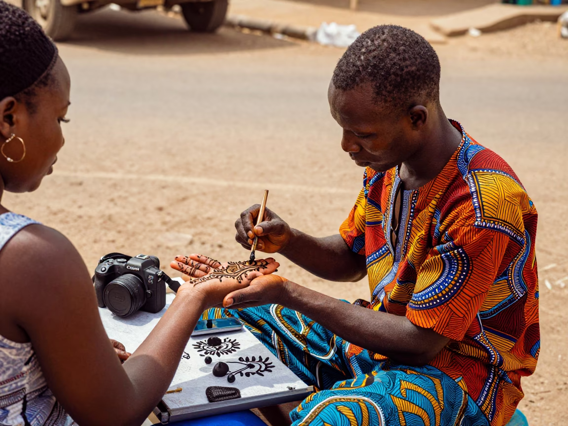 Colorful Street Vendor in Dakar Senegal Selling Henna Tattoos in Early Afternoon Light in in Dakar, Senegal
