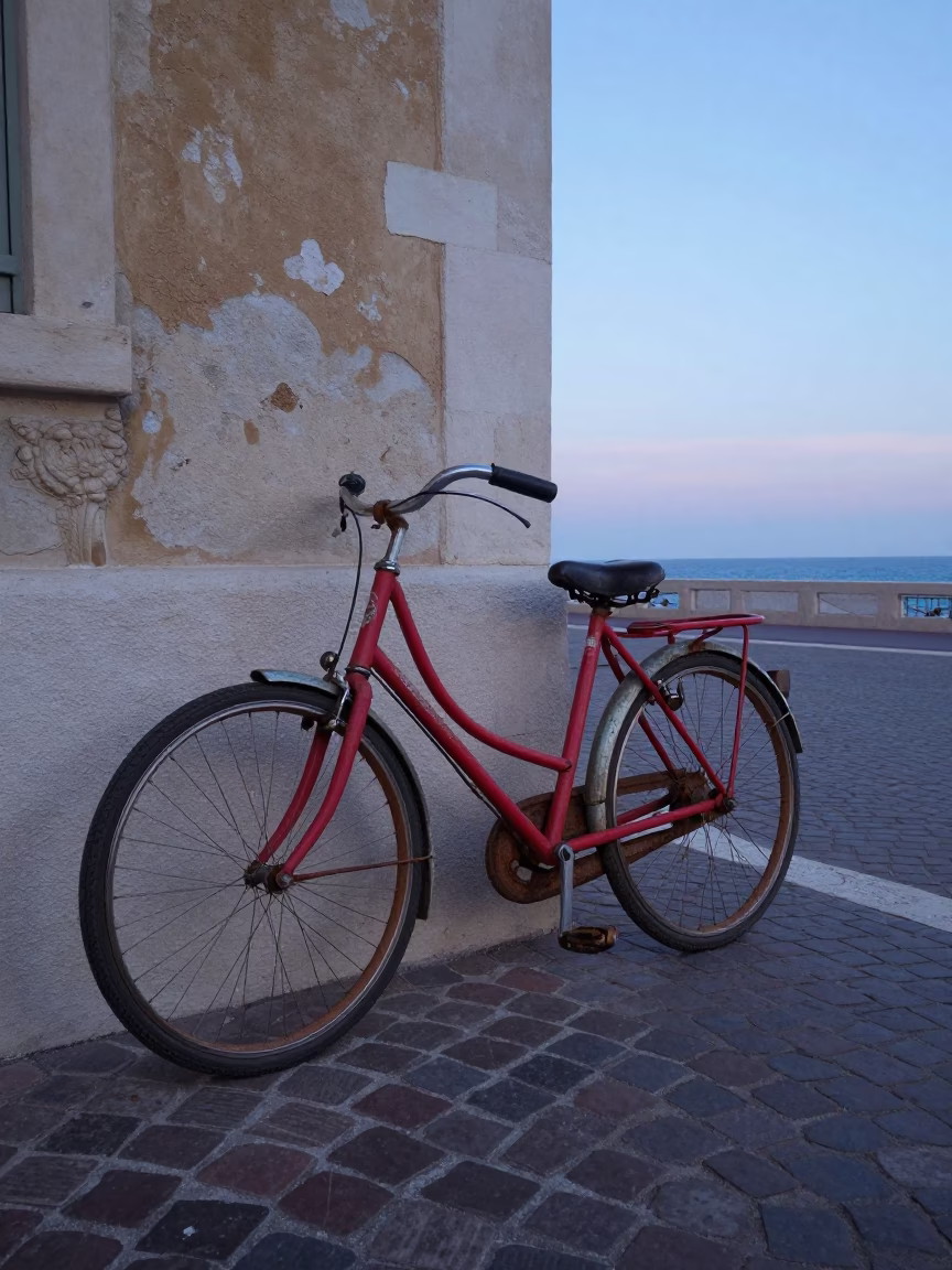 Colorful Vintage Bicycle Parked on Nice French Cobblestone Street at Nautical Dawn in in Nice, France