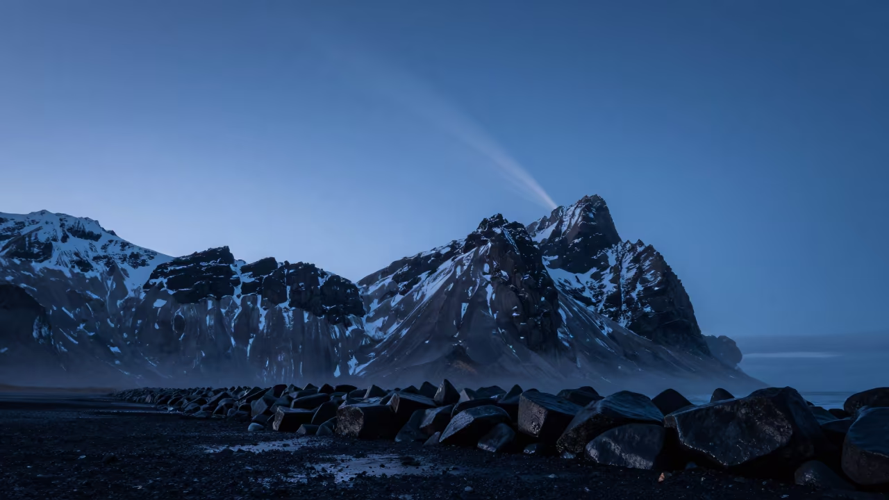 Comet Tail Over Snow Peak Iceland Twilight in from a moonlit breakwater in Iceland