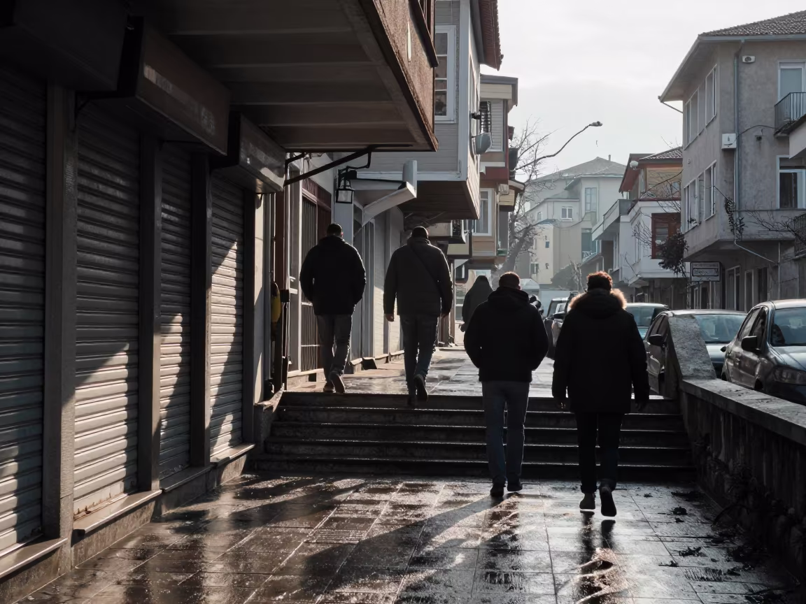 Commuters Ascend Wet Stairs from Trabzon Underpass in along a shuttered arcade in Trabzon