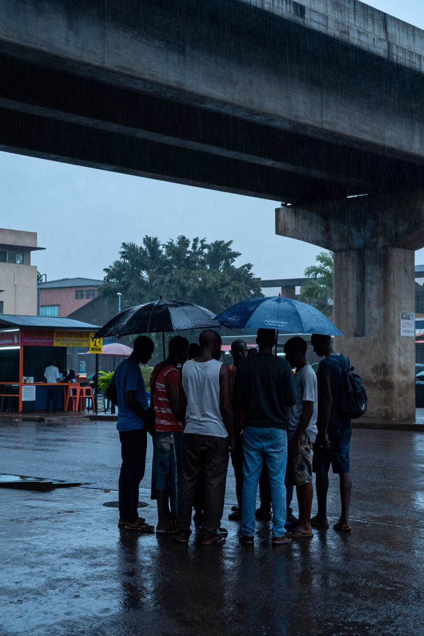 Commuters Under Bamako Overpass in Blue Hour Rain in outside a corner cafe in Bamako