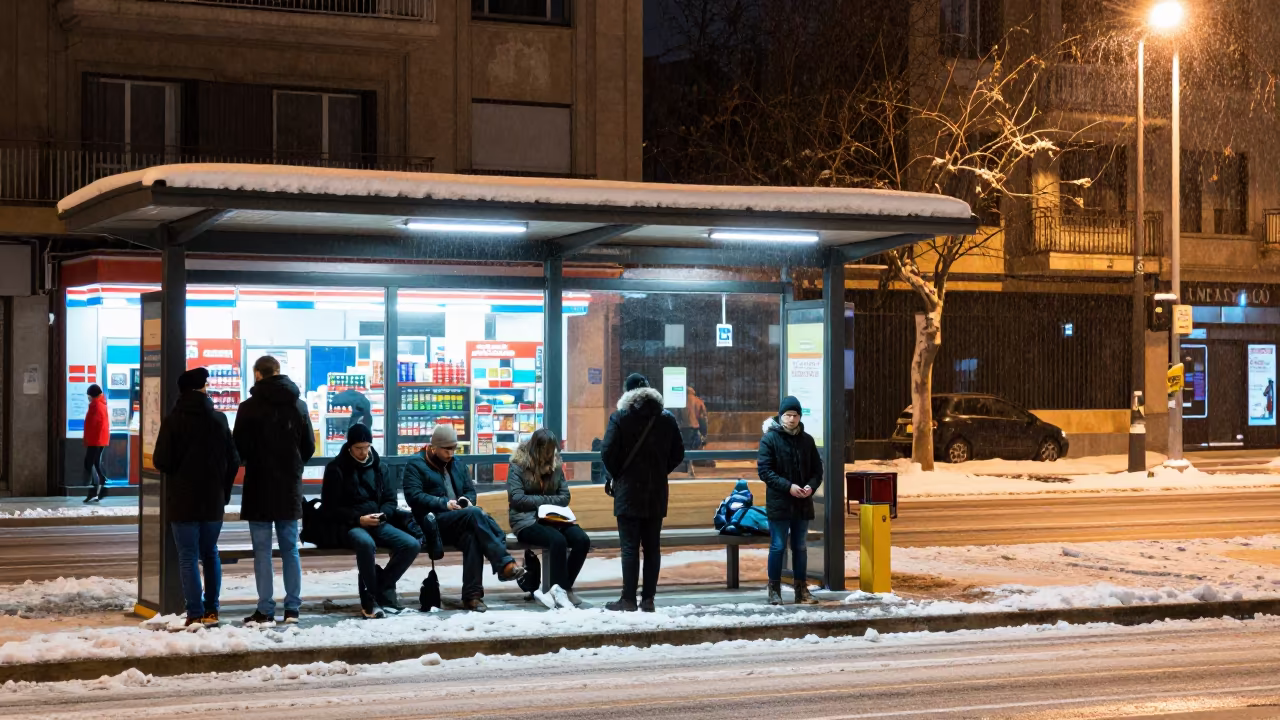 Commuters Under Heat Lamps in Winter Snow and Sun in outside a fluorescent convenience store in Elche