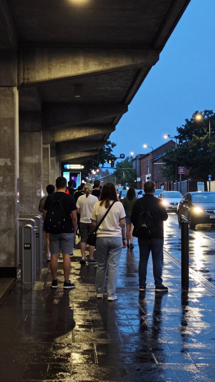 Commuters Under Stoke-on-Trent Awning in Blue Hour in outside a metro entrance in Stoke-on-Trent