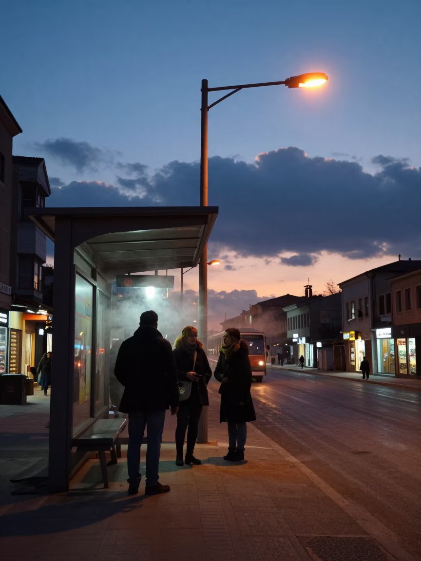 Commuters Warm Under Heat Lamps at Winter Tram Stop in beside a steamed-up bus shelter in Şanlıurfa