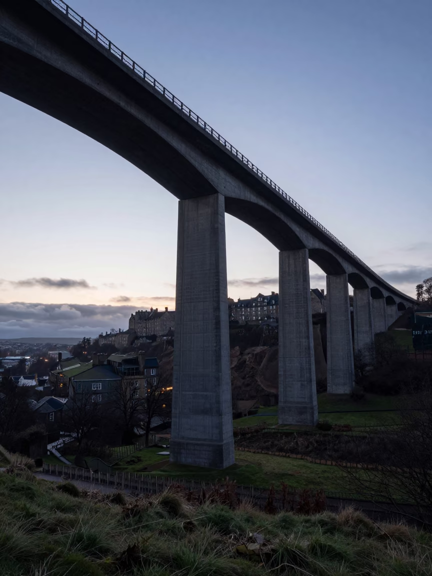 Concrete Viaduct Curving Across Edinburgh Valley Floor at Dawn Before Sunrise in in Edinburgh, United Kingdom