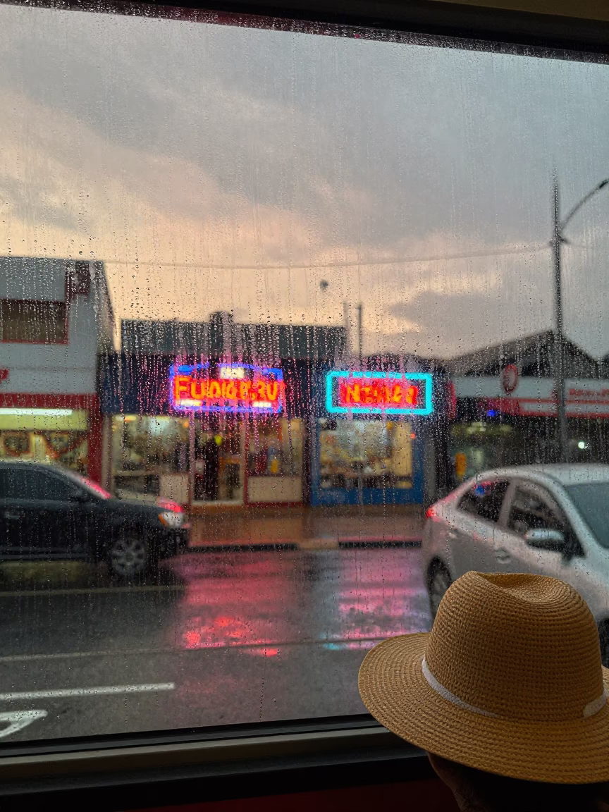 Condensation on glass and sun hat in Durban light rain dusk street in in Durban, South Africa