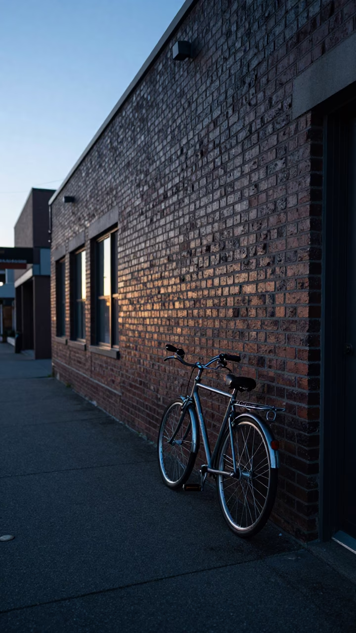 Cool Pre-Dawn Vancouver Street Scene with Bicycle Leaning Against Brick Building in in Vancouver, British Columbia, Canada