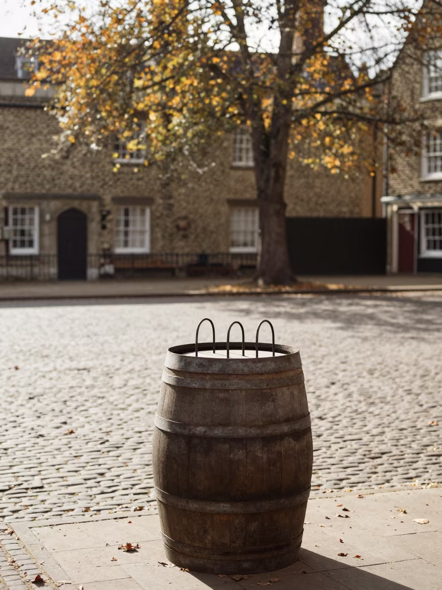 Cooper Fitting Hoops on Barrel in Cambridge Autumn in in the old quarter in Cambridge
