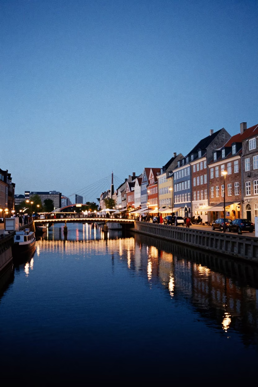 Copenhagen canal twilight with illuminated bridge and reflections in in Copenhagen, Denmark
