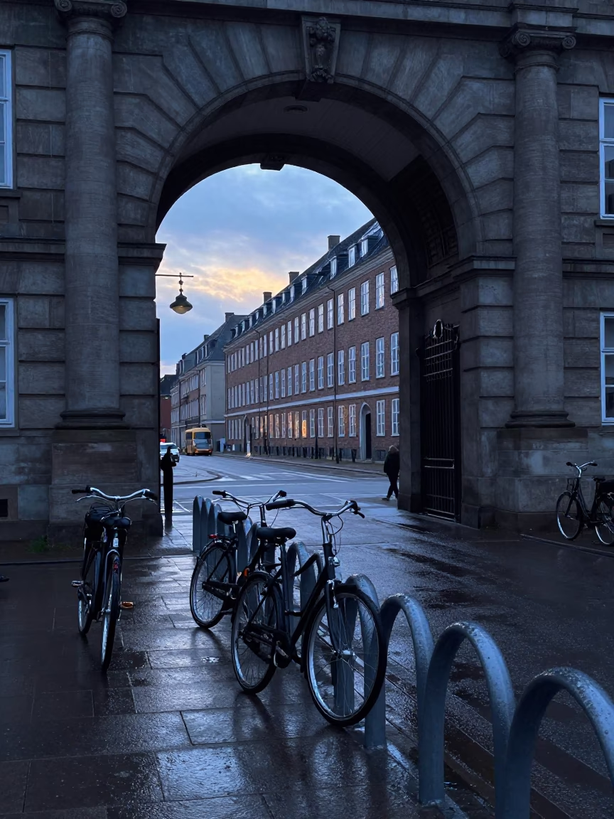 Copenhagen Denmark before sunrise university archway wet bicycle rack and observatory fog in in Copenhagen, Denmark