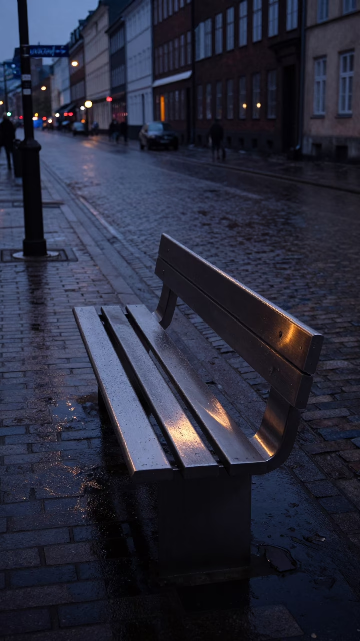 Copenhagen Denmark Predawn Street Scene with Brushed Steel Bench and Bicycle in in Copenhagen, Denmark