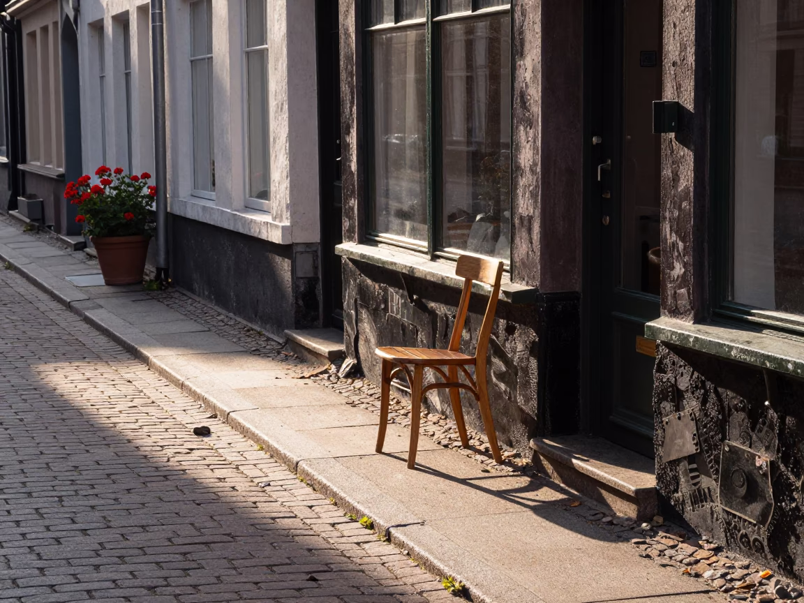 Copenhagen Denmark Street Scene First Light with Geraniums and Chair in in Copenhagen, Denmark